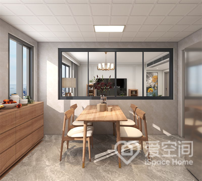 餐桌椅温润平和，餐边柜以简洁的原木做造型，柜门无把手设计，大大提升了餐厅空间的整洁感。
