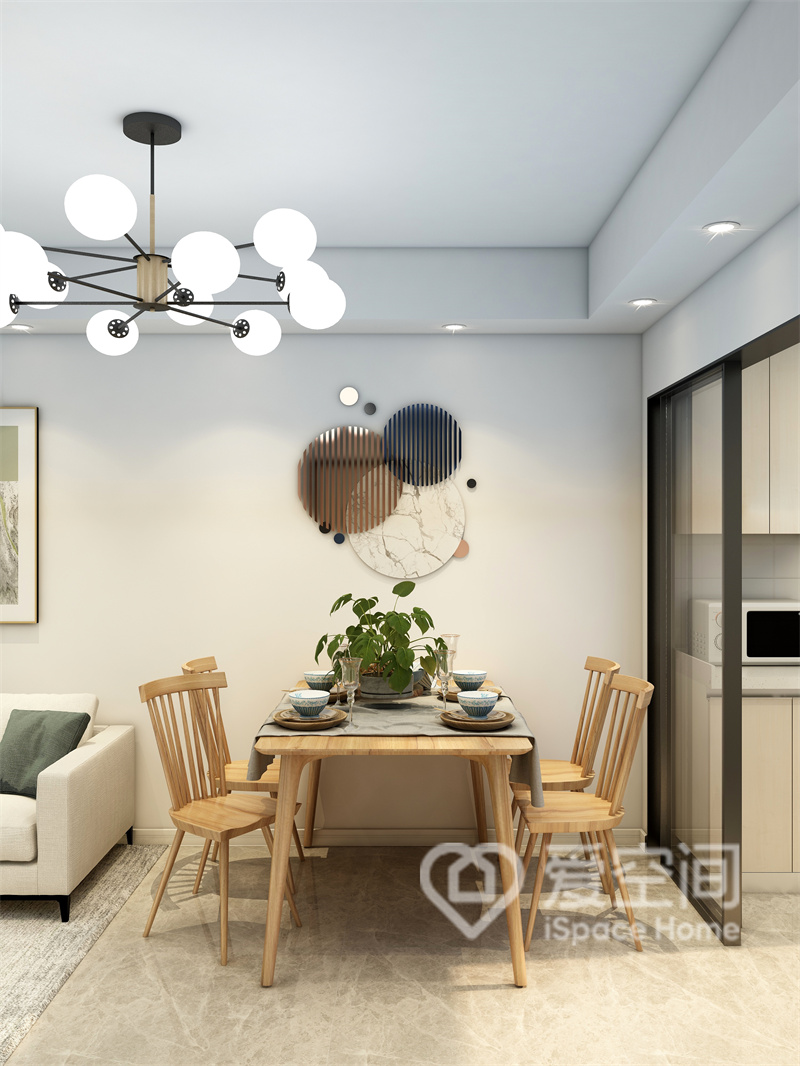 餐桌椅选用原木材质样式，简雅而温馨，灯具、装饰画和绿植让人有种悠然、惬意的感觉。