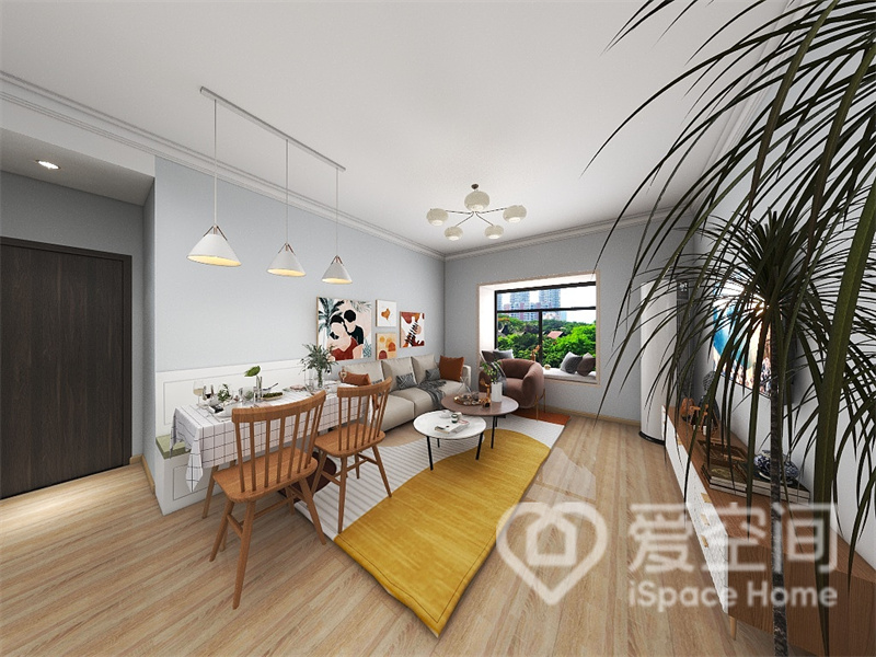 客餐一体，灰蓝色背景墙柔雅大气，家的温度也得以串联，餐厅设计了卡座，释放出更多活动空间。