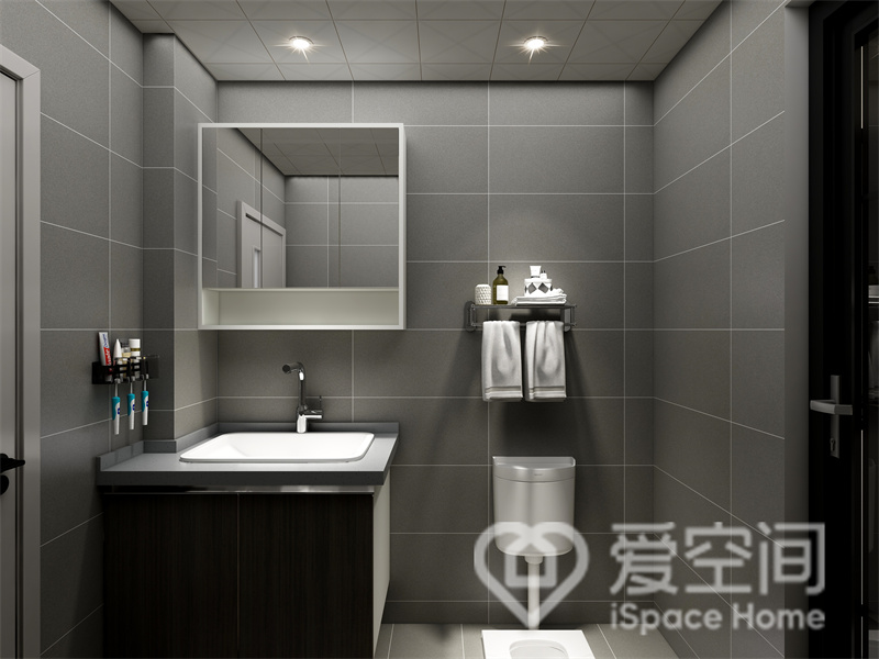 卫生间以深灰色为背景，利用家具洁具的有序放置，构建出流畅东西那，整体简约又不失时尚感。
