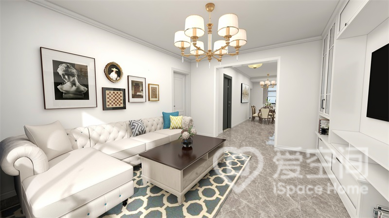客厅采用白色涂料为底，搭配艺术装饰挂画，显现出层次感和高级感。