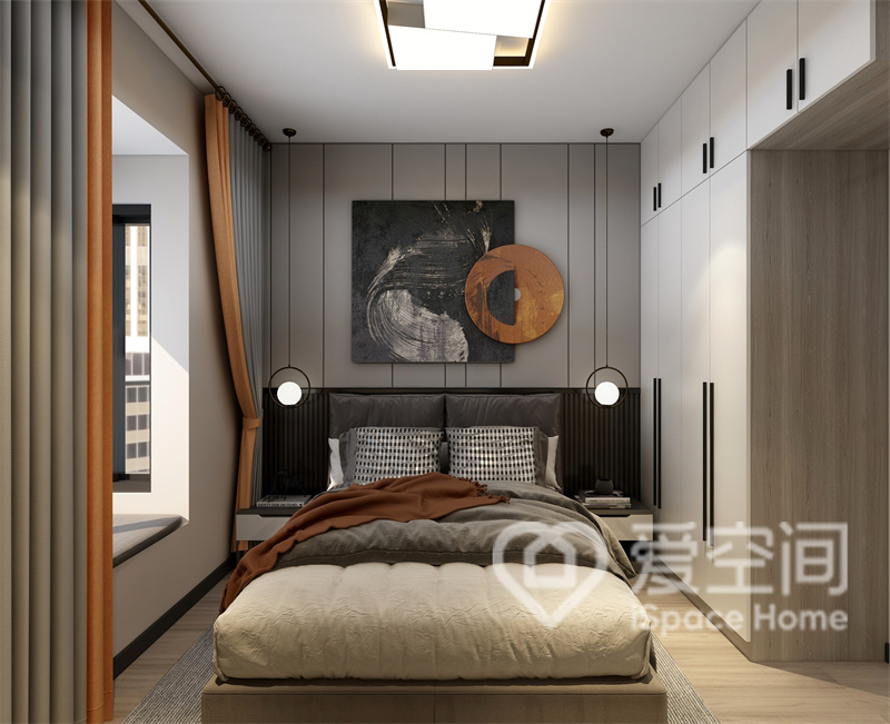 次卧的背景墙造型采用几何结构装饰，搭配黑橘色元素，彰显出现代简约主义的时尚风格。