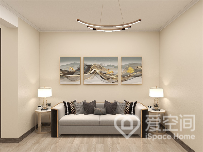 整个客厅空间以米色为主基调，无过多装饰背景墙简约时尚，装饰画的搭配，提升了空间的美观效果。