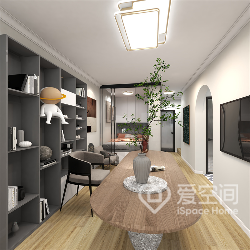 客厅采用温和明朗的白色为底色，室内家具疏密有序，动线规划十分合理，书柜设计简约，高级灰气质增加了空间的稳重感。