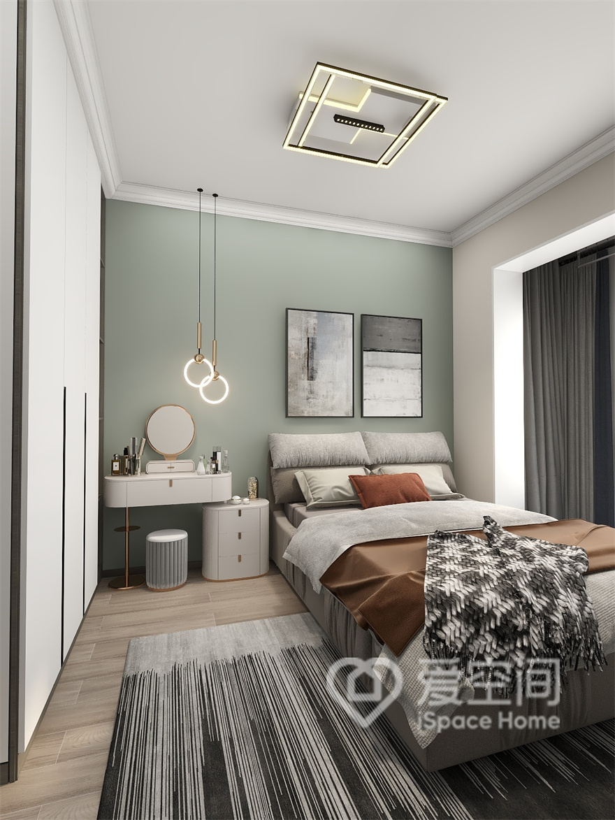 次卧果绿色与橘色撞色设计，符合业主独特的审美，设计师巧妙地运用软装搭配，让人感受到温馨与细腻。