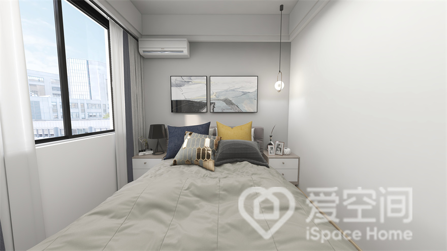 暖色抱枕为次卧注入舒心无压的视觉感受，背景墙加入挂画装饰，空间的设计感得到很大的提升。