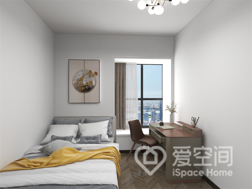 次卧空间中没有繁复的中式家具，床体靠墙放置，临窗处置放了写字桌椅，散发出简约生活的美感。
