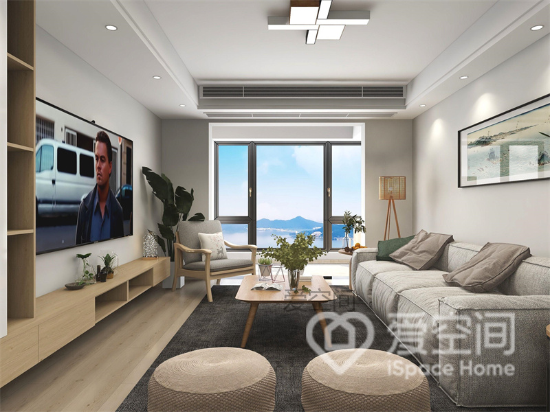 客厅采用了低矮家具，布艺沙发精致优雅，揉合了原木茶几和原木地柜，塑造出日系生活的惬意氛围。